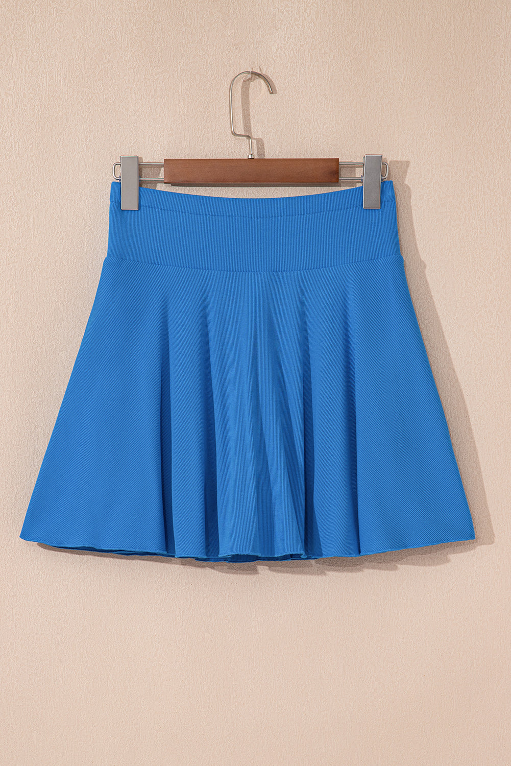 Jupe-short doublée drapée taille haute coupe trapèze bleu avec poche téléphone