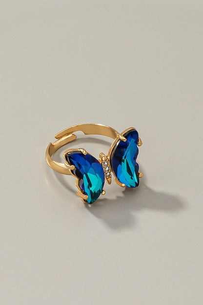 Butterfly ring with adjustable brass band